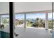 Balcony view of the ocean and the street with beach access, lush foliage and coastal views at 502 W Ashley Ave, Folly Beach, SC 29439