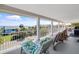 Balcony with chairs featuring a beach view and lush greenery with palm trees at 502 W Ashley Ave, Folly Beach, SC 29439