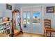 Balcony with white railings overlooking the beach with a view of the ocean and tropical foliage at 502 W Ashley Ave, Folly Beach, SC 29439