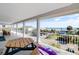 Balcony with ocean view, outdoor dining set, and lounge chair, perfect for relaxing at 502 W Ashley Ave, Folly Beach, SC 29439
