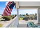 Balcony featuring an American flag and a stunning beach view with palm trees at 502 W Ashley Ave, Folly Beach, SC 29439