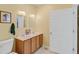 Bathroom featuring double sinks, a toilet, and a door at 502 W Ashley Ave, Folly Beach, SC 29439