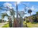 Public beach access sign with palm trees at 502 W Ashley Ave, Folly Beach, SC 29439