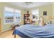 Bright bedroom with large windows offering natural light and views of the outdoors at 502 W Ashley Ave, Folly Beach, SC 29439