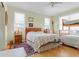 Bright bedroom with a ceiling fan, two beds, a bunk bed and two dressers at 502 W Ashley Ave, Folly Beach, SC 29439