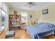 Cozy bedroom with large windows offering natural light and views of the outdoors at 502 W Ashley Ave, Folly Beach, SC 29439
