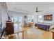 Main bedroom with access to a deck with ocean views, and a ceiling fan at 502 W Ashley Ave, Folly Beach, SC 29439