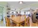 Dining room showing the kitchen, a wooden dining table and a cat tree at 502 W Ashley Ave, Folly Beach, SC 29439