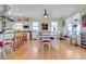 Eat-in kitchen and dining area with abundant natural light and hardwood floors at 502 W Ashley Ave, Folly Beach, SC 29439