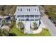 Beautiful three story home with double balconies, palm trees, and eye-catching curb appeal at 502 W Ashley Ave, Folly Beach, SC 29439