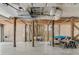 Open garage area with wooden support beams and functional utilities, providing ample storage and workshop space at 502 W Ashley Ave, Folly Beach, SC 29439
