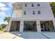 Ample covered parking and storage space under the elevated home, perfect for beach gear and vehicles with easy beach access at 502 W Ashley Ave, Folly Beach, SC 29439