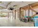 Expansive ground-level area with concrete flooring and overhead utilities, offering versatile space for parking and recreational activities at 502 W Ashley Ave, Folly Beach, SC 29439