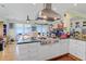 Modern kitchen with stainless steel appliances and an island cooktop at 502 W Ashley Ave, Folly Beach, SC 29439