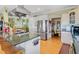 Spacious kitchen with stainless appliances and an island with bar seating at 502 W Ashley Ave, Folly Beach, SC 29439