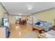 Open-concept living room and dining room offers an inviting space with lots of natural light at 502 W Ashley Ave, Folly Beach, SC 29439
