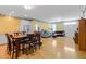 Open-concept living room and dining room featuring hardwood floors and ample natural light at 502 W Ashley Ave, Folly Beach, SC 29439