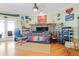 Cozy living room with a brick fireplace, comfortable seating, and hardwood floors at 502 W Ashley Ave, Folly Beach, SC 29439