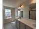 This bathroom offers dual sinks and luxury vinyl flooring at 5126 Double Eagle, Summerville, SC 29485