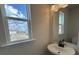 Bathroom with sink, mirror, and window showcasing the outside view at 5126 Double Eagle, Summerville, SC 29485