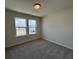 This bedroom features plush carpet and natural light streaming through its double windows at 5126 Double Eagle, Summerville, SC 29485