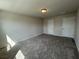 A carpeted bedroom featuring two doors and a ceiling light at 5126 Double Eagle, Summerville, SC 29485