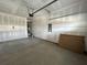 Spacious unfinished garage featuring concrete flooring, water heater and electrical panel at 5126 Double Eagle, Summerville, SC 29485