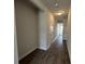 View of hallway with luxury vinyl floors and access to other rooms at 5126 Double Eagle, Summerville, SC 29485