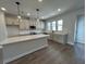 Gourmet kitchen featuring a center island, modern lighting and new stainless steel appliances at 5126 Double Eagle, Summerville, SC 29485