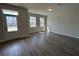 Living room with ample sunlight, wood floors, and view of neighborhood at 5126 Double Eagle, Summerville, SC 29485