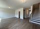 Open floor plan with modern flooring and stairs leading up to the second floor at 5126 Double Eagle, Summerville, SC 29485