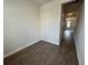 Empty room with luxury vinyl floors, access to hallway, and natural light at 5126 Double Eagle, Summerville, SC 29485