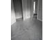 Bedroom includes gray carpet, white trim, and features three doors at 6201 Drayton St, Ravenel, SC 29470
