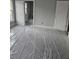 Bedroom with gray carpet, white trim, and features bright windows at 6201 Drayton St, Ravenel, SC 29470