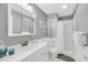 Well-lit bathroom featuring a tiled shower, light grey walls, and a modern vanity at 626 Double Eagle Trce, Johns Island, SC 29455