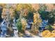 Aerial view of a neighborhood featuring well-maintained homes, mature trees, and manicured lawns in the autumn at 635 Fair Spring Dr, Charleston, SC 29414