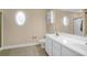Bathroom with a double sink vanity, decorative mirror, and tile flooring at 635 Fair Spring Dr, Charleston, SC 29414