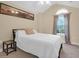 Relaxing bedroom featuring a cozy bed, bedside table, and a window for natural light at 635 Fair Spring Dr, Charleston, SC 29414