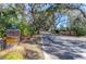 Elegant brick entry featuring lush landscaping and a neighborhood welcome sign at 635 Fair Spring Dr, Charleston, SC 29414