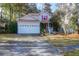 Charming two-story home with a well-maintained front yard, a two car garage and inviting curb appeal at 635 Fair Spring Dr, Charleston, SC 29414