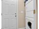 Convenient laundry area with a stacked washer and dryer unit and easy access to a door at 635 Fair Spring Dr, Charleston, SC 29414