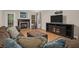 Cozy living room featuring a fireplace, hardwood floors, and comfortable seating at 635 Fair Spring Dr, Charleston, SC 29414