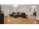Open-concept living room with hardwood floors, comfortable seating, and ample natural light at 635 Fair Spring Dr, Charleston, SC 29414