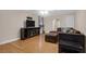 Spacious living room with hardwood floors, neutral walls, and a comfortable seating arrangement at 635 Fair Spring Dr, Charleston, SC 29414