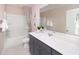 Bathroom featuring a single sink vanity, tub-shower combination, and neutral color palette at 743 Meadowbrook Ln, Summerville, SC 29486