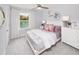 Bright bedroom with a lake view, white furniture, and soft, lilac accents at 743 Meadowbrook Ln, Summerville, SC 29486