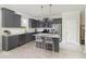 Modern kitchen with gray cabinets, stainless steel appliances, granite countertops, and a center island at 743 Meadowbrook Ln, Summerville, SC 29486
