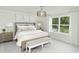 Serene primary bedroom with a large window, soft lighting, and a comfortable king-size bed at 743 Meadowbrook Ln, Summerville, SC 29486