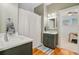 Modern bathroom featuring double vanities, stylish mirrors, and elegant lighting fixtures at 744 Gate Post Dr, Mount Pleasant, SC 29464