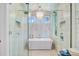 Stunning bathroom featuring a glass shower, free-standing tub, and contemporary fixtures at 744 Gate Post Dr, Mount Pleasant, SC 29464